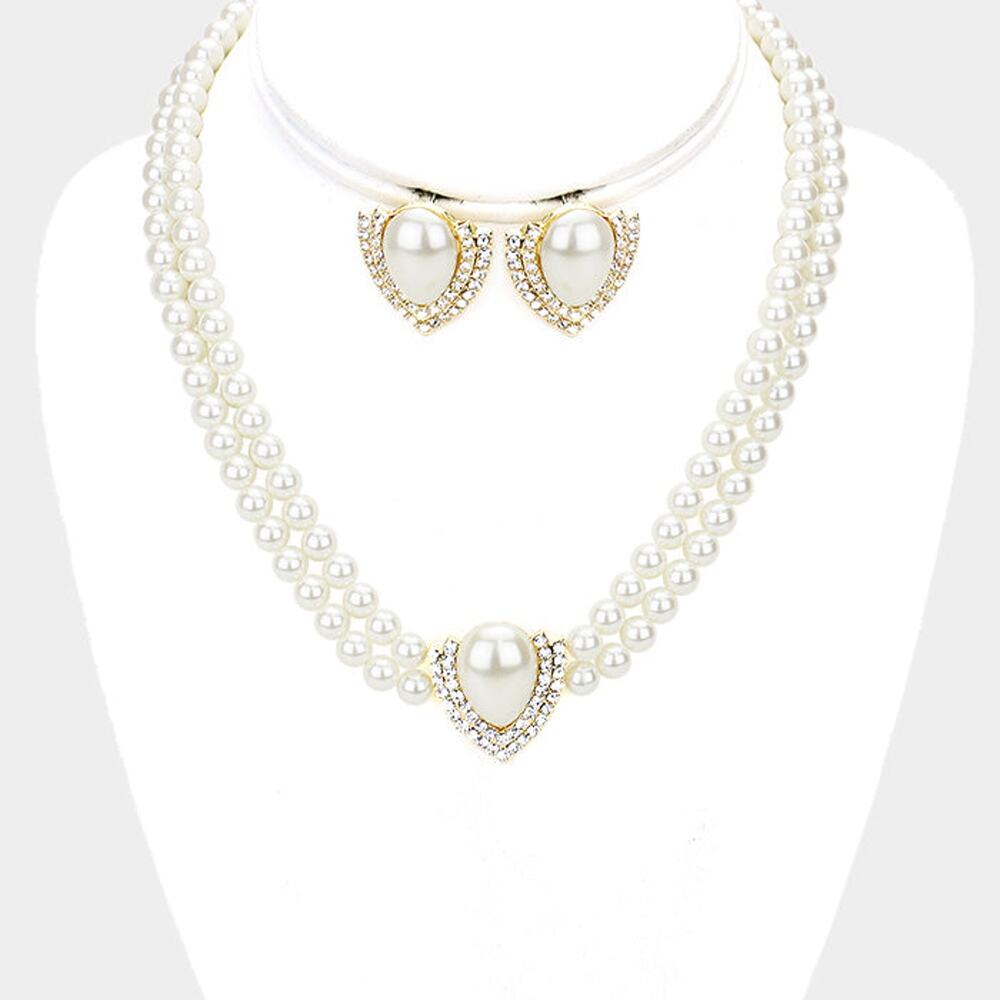 Pierced gold, white pearl pointed necklace and earring set with clear stones